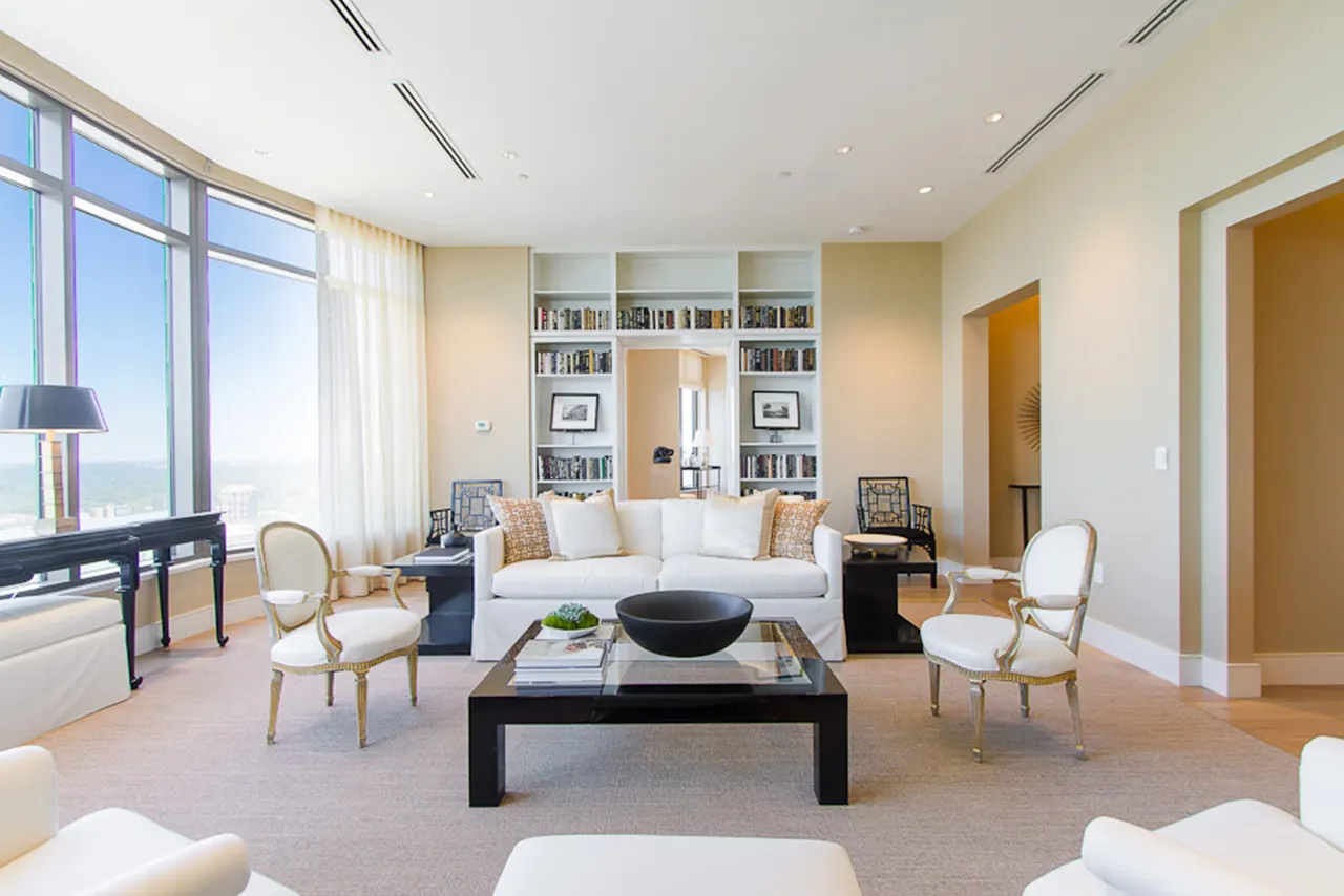 Blurred abstract background interior view looking out toward to empty office lobby and entrance doors and glass curtain wall with frame - blue white balance processing style
